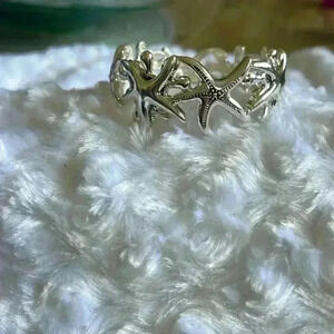 Silver tone sea star bracelet.